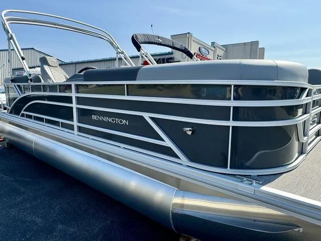 Slide: The Image of 2024 Bennington 22 SSR boat interior with gray seating and logo. - 3