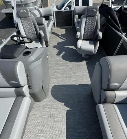 Slide: The Image of 2024 Bennington 22 SSR boat dashboard with steering wheel and control panel. - 4