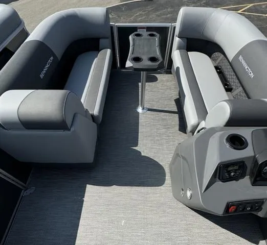 Slide: The Image of 2024 Bennington 22 SSR pontoon boat interior with gray seating and carpet. - 5