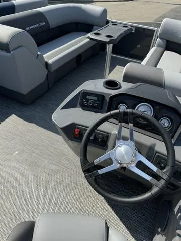 Slide: The Image of 2024 Bennington 22 SSR boat interior seating with gray and white upholstery. - 6