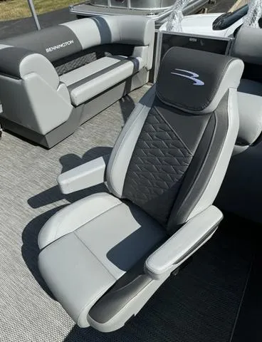Slide: The Image of 2024 Bennington 22 SSR pontoon boat interior with gray and white seating. - 7