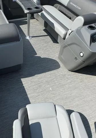 Slide: The Image of 2024 Bennington 22 SSR boat interior seating in gray and white. - 9