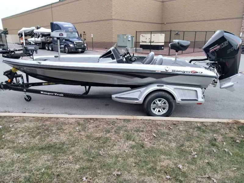 Slide: The Image of 2024 Ranger Z518 Ranger Cup Equipped fishing boat on trailer. - 2