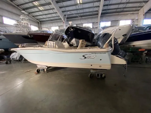 The Image of 2024 Scout 195 Sport Dorado boat in a showroom, side view. - 0