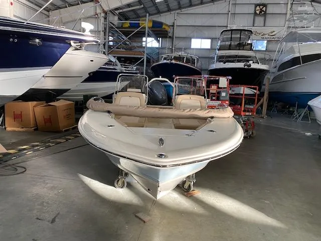 Slide: The Image of 2024 Scout 195 Sport Dorado boat in a storage facility. - 2