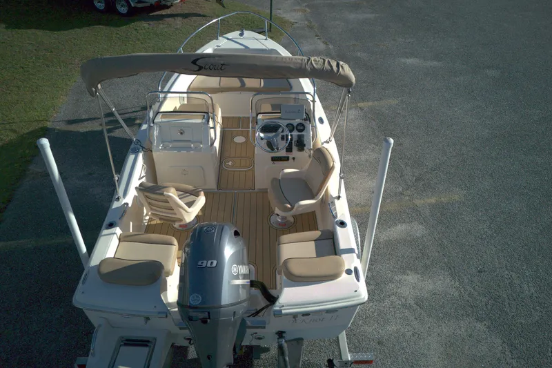Slide: The Image of 2019 Scout 175 Dorado boat with Yamaha 90 engine, beige seating, and steering console. - 8