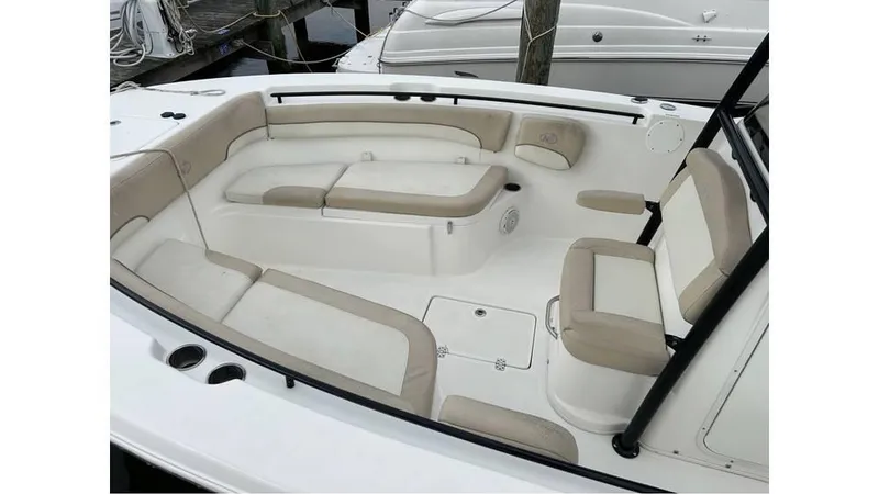 Slide: The Image of 2018 NauticStar 2800 XS boat interior with beige and white seating. - 5