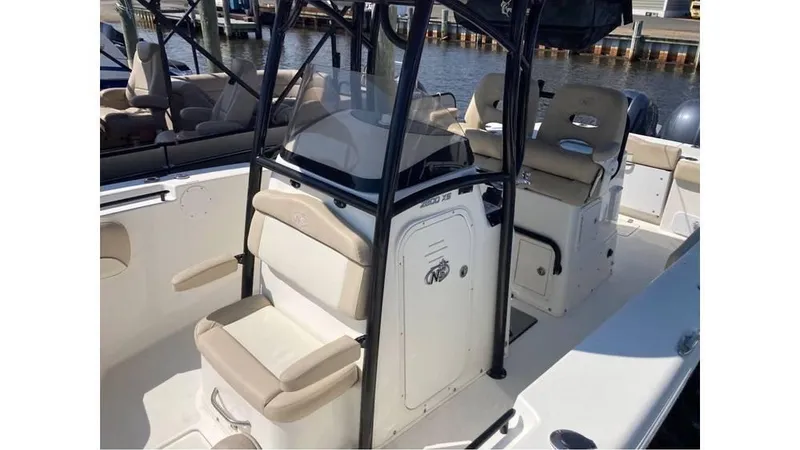 Slide: The Image of 2018 NauticStar 2800 XS boat interior with seating and console. - 6