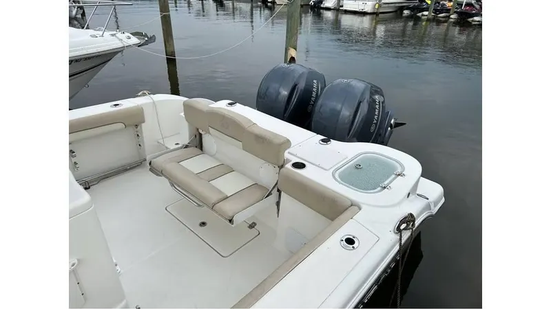 Slide: The Image of 2018 NauticStar 2800 XS boat with twin outboard engines at dock. - 8