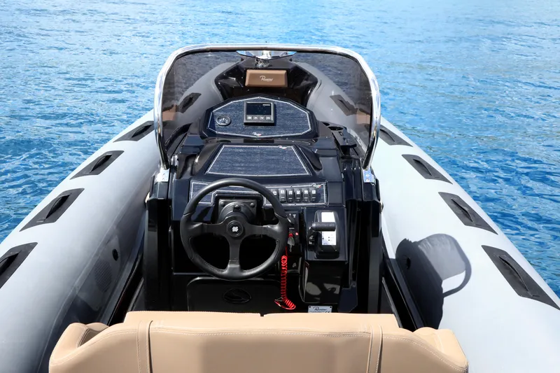 Slide: The Image of 2023 Ranieri CAYMAN 26 SPORT TOURING boat dashboard on blue water. - 15