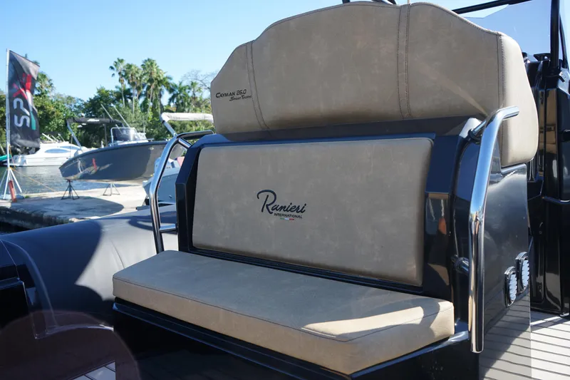 Slide: The Image of 2023 Ranieri CAYMAN 26 SPORT TOURING boat, rear seating area with logo. - 25