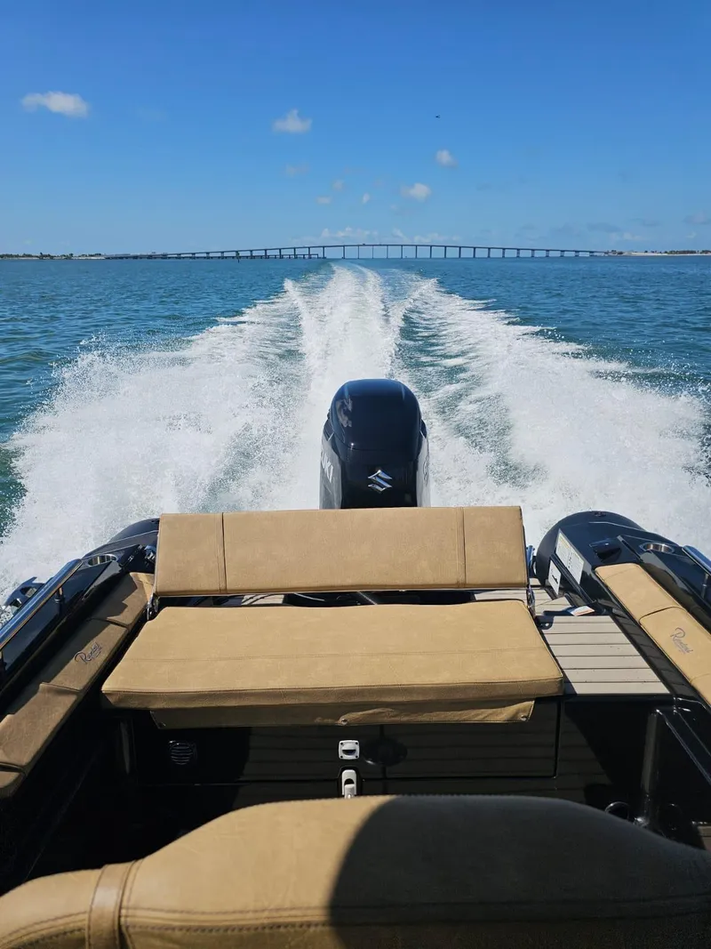 Slide: The Image of 2023 Ranieri CAYMAN 26 SPORT TOURING speeding on open water. - 32