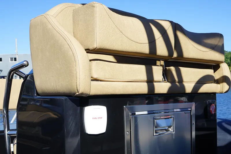 Slide: The Image of Rear seating and storage on 2023 Ranieri CAYMAN 26 SPORT TOURING boat. - 33