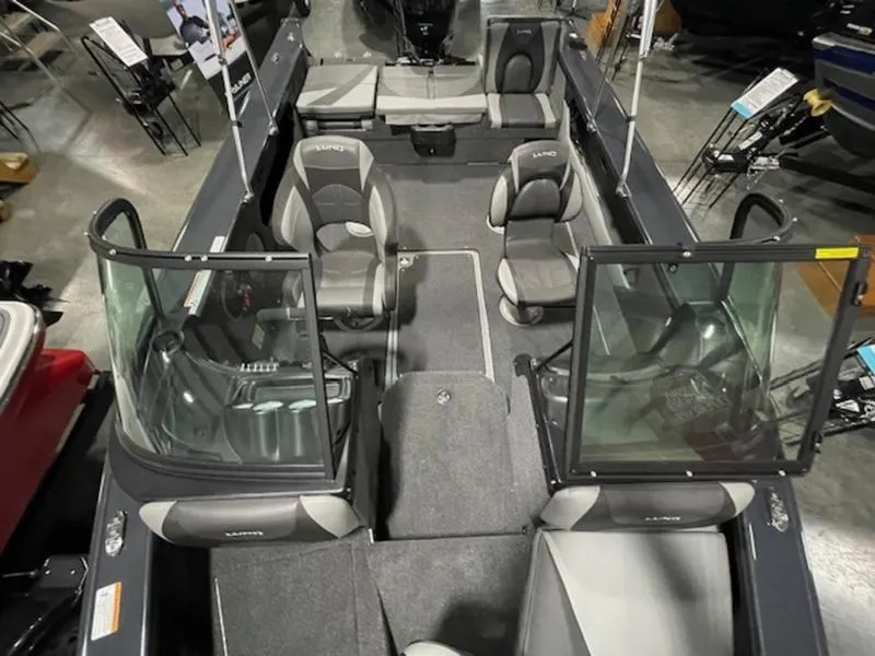 Slide: The Image of 2024 Lund 1875 Crossover XS Sport boat interior with seating and windshield. - 10