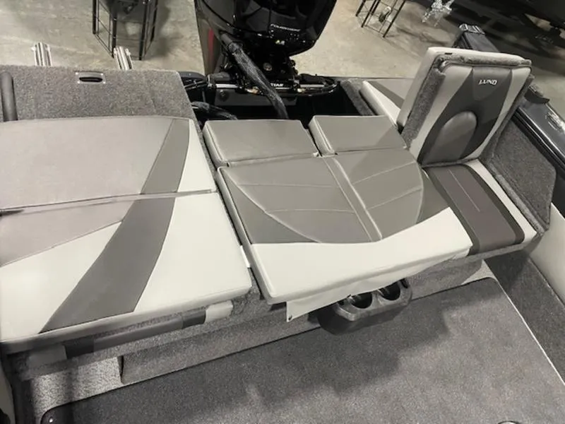 Slide: The Image of 2024 Lund 1875 Crossover XS Sport boat interior with gray and white seating. - 5