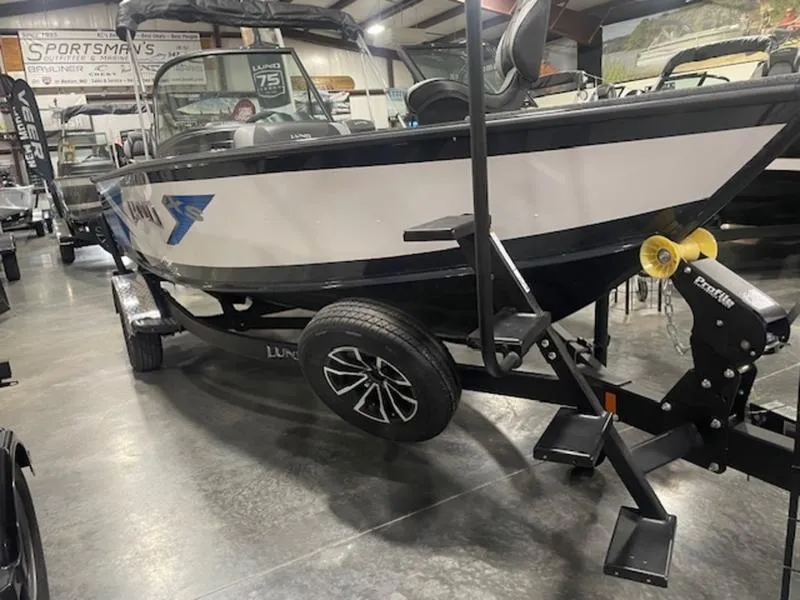 Slide: The Image of 2024 Lund 1875 Crossover XS Sport boat on display in showroom. - 7