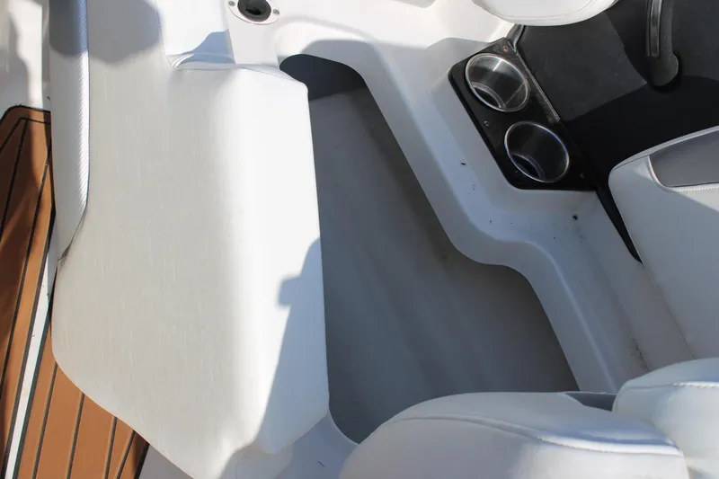 Slide: The Image of Interior of 2013 Monterey 234 SS boat with cup holders and seating. - 14