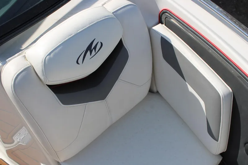 Slide: The Image of 2013 Monterey 234 SS boat seat with logo, white and gray upholstery. - 27