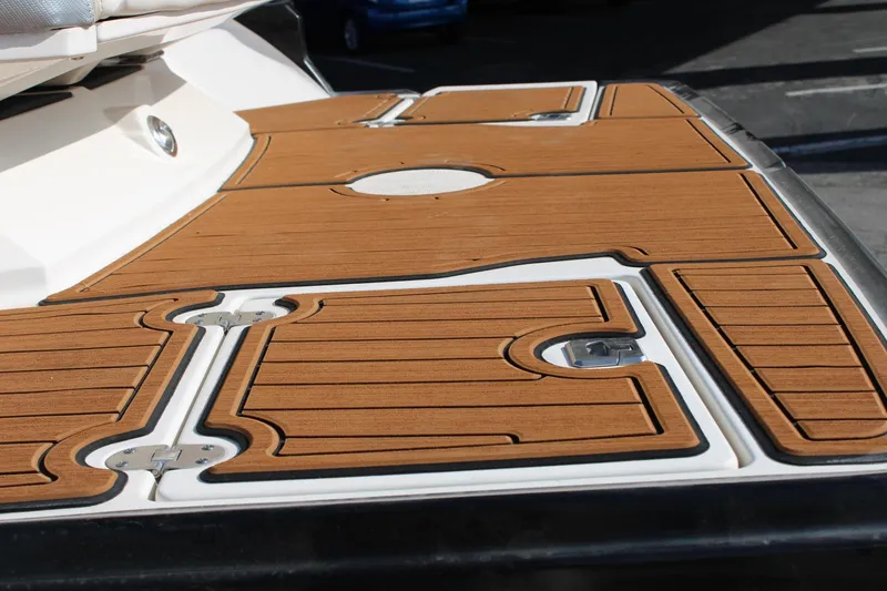 Slide: The Image of 2013 Monterey 234 SS boat deck with teak-style flooring. - 34