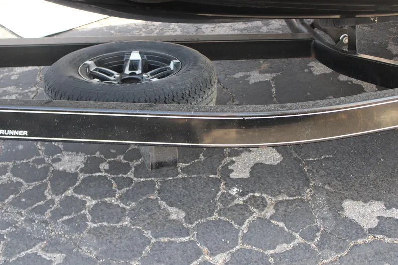 Slide: The Image of Spare tire on a trailer for a 2013 Monterey 234 SS boat. - 6