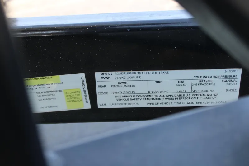 Slide: The Image of Label on 2013 Monterey 234 SS trailer detailing weight and tire specifications. - 21