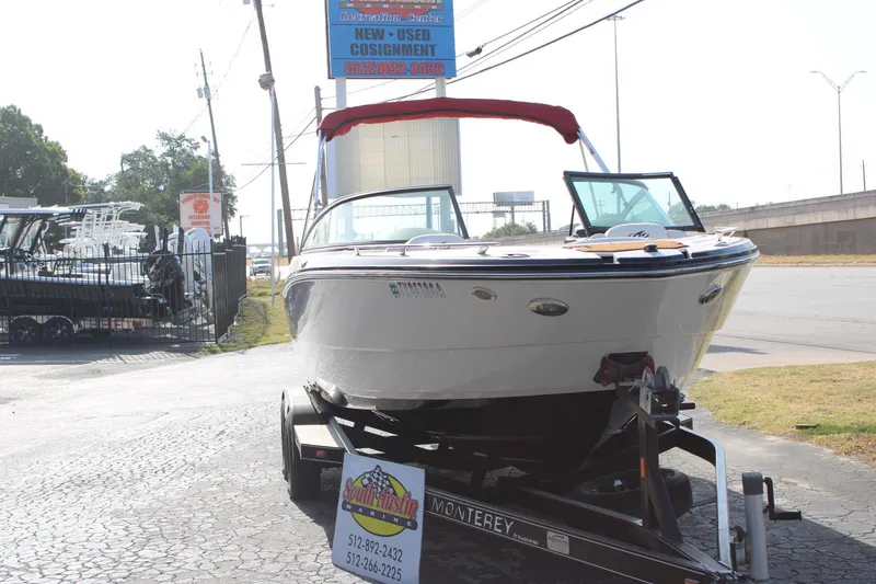 Slide: The Image of 2013 Monterey 234 SS boat on trailer at dealership. - 3