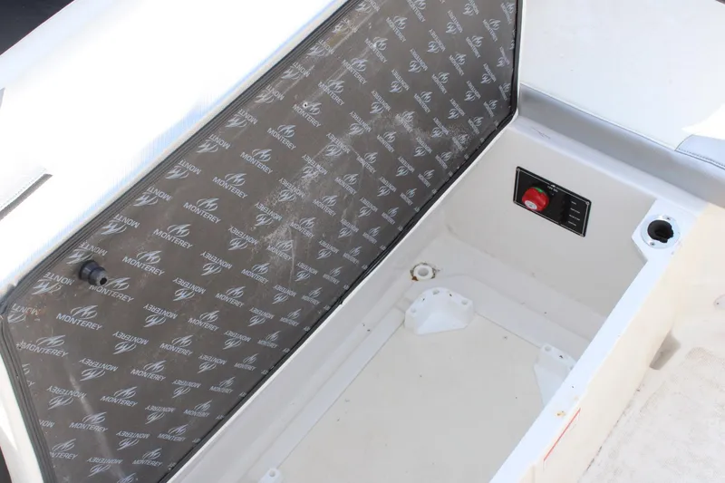 Slide: The Image of Open storage compartment in 2013 Monterey 234 SS boat. - 31
