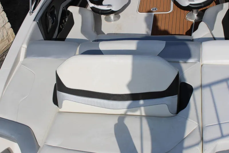 Slide: The Image of 2013 Monterey 234 SS boat interior with white and black seating. - 8