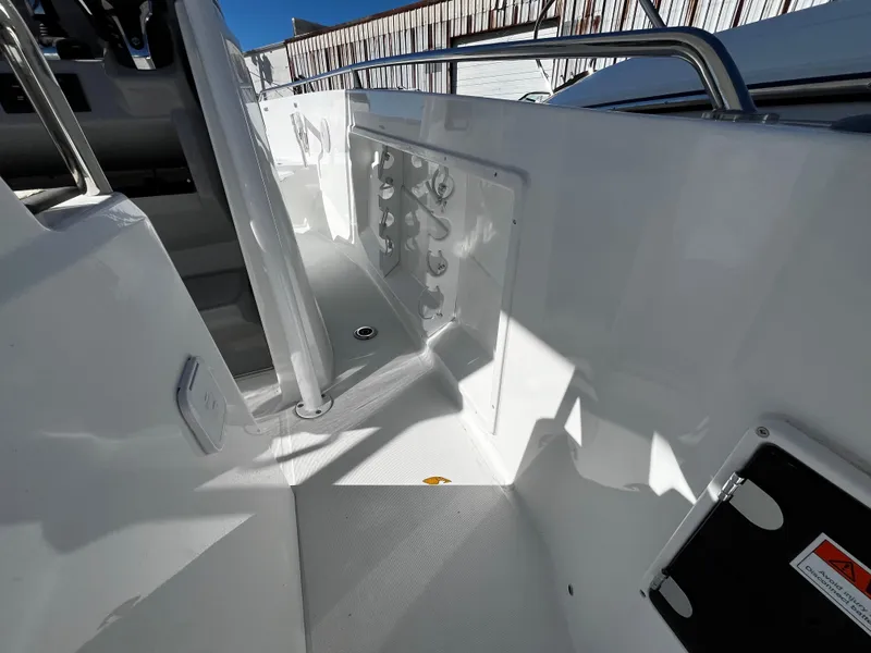 Slide: The Image of 2024 Jeanneau Leader 7.5 CC Series 3 boat interior, white deck and seating area. - 28