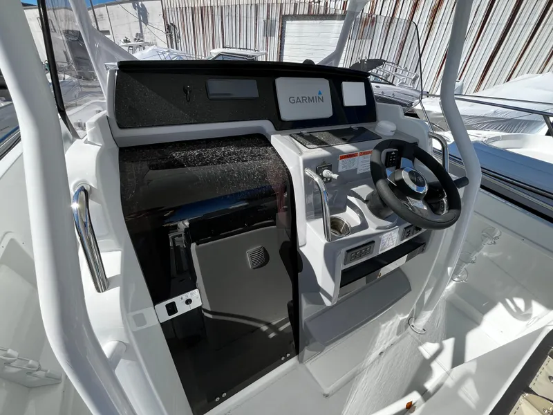 Slide: The Image of 2024 Jeanneau Leader 7.5 CC Series 3 helm with Garmin navigation system. - 32