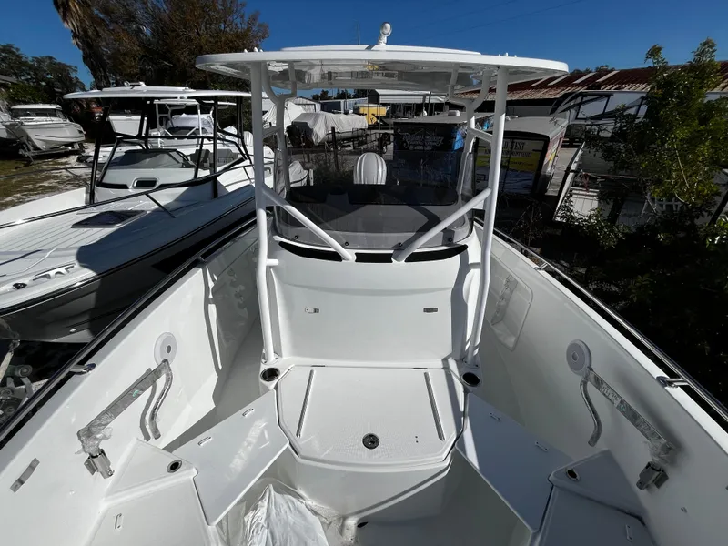 Slide: The Image of 2024 Jeanneau Leader 7.5 CC Series 3 boat interior, white deck, and seating area. - 35