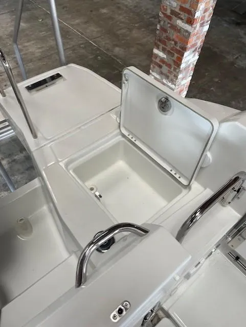 Slide: The Image of 2024 Jeanneau Leader 7.5 CC Series 3 boat with open storage compartment. - 48