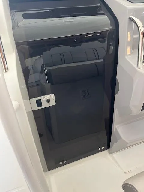 Slide: The Image of 2024 Jeanneau Leader 7.5 CC Series 3 cabin door and interior view. - 11
