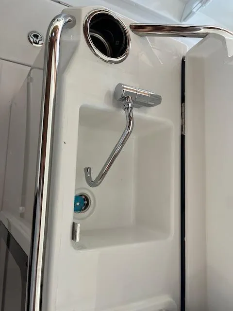 Slide: The Image of 2024 Jeanneau Leader 7.5 CC Series 3 boat interior detail with chrome fixtures. - 19