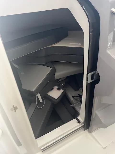 Slide: The Image of 2024 Jeanneau Leader 7.5 CC Series 3 cabin interior with seating and storage. - 28
