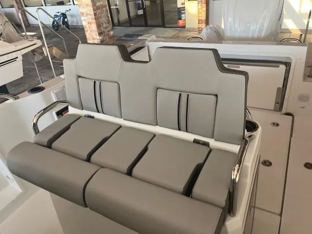 Slide: The Image of 2024 Jeanneau Leader 7.5 CC Series 3 boat seating area in showroom. - 6