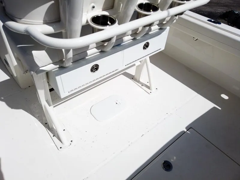 Slide: The Image of 2025 Regulator 23 Center Console boat interior with storage compartments and cup holders. - 13