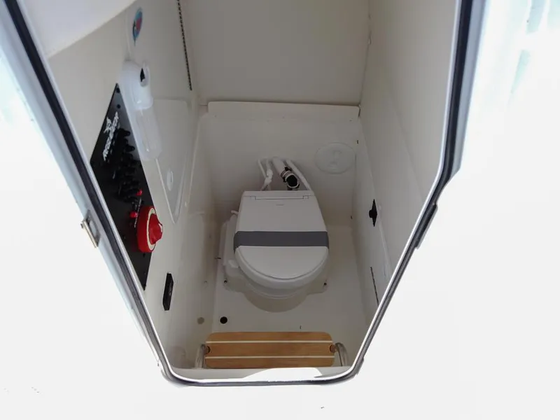 Slide: The Image of 2025 Regulator 23 Center Console boat interior with marine toilet. - 14
