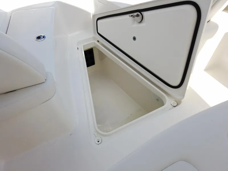 Slide: The Image of Open storage compartment on 2025 Regulator 23 Center Console boat. - 16
