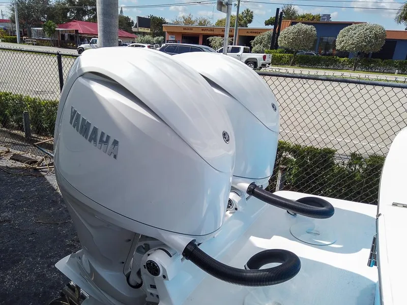 Slide: The Image of 2025 Regulator 23 Center Console with twin Yamaha outboard engines. - 18