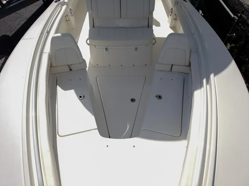 Slide: The Image of 2025 Regulator 23 Center Console boat interior with seating and storage compartments. - 4
