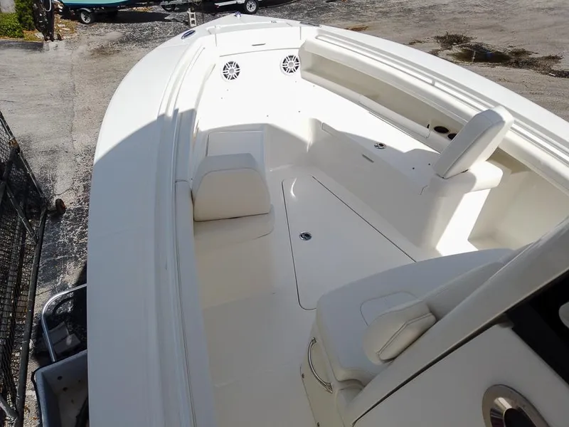 Slide: The Image of 2025 Regulator 23 Center Console boat interior with seating and storage compartments. - 8