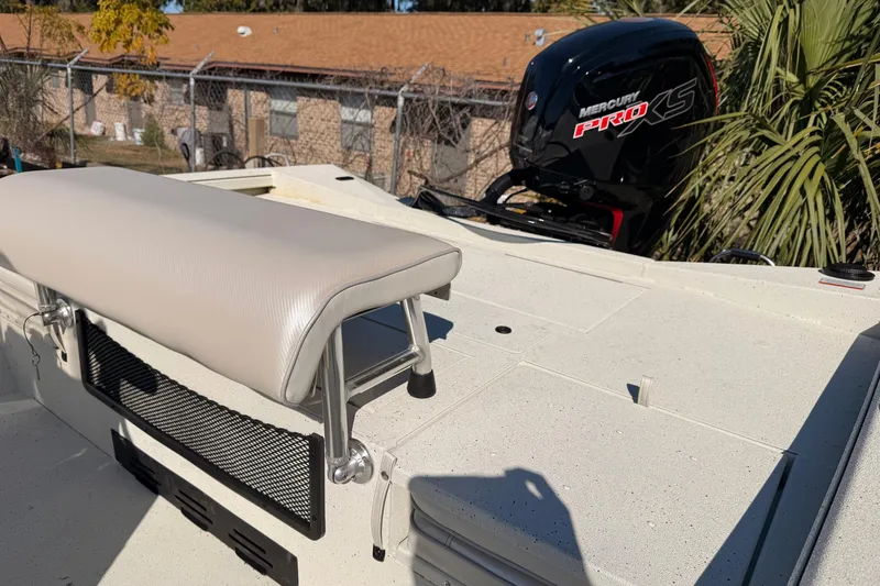 Slide: The Image of 2026 Ranger RB190 boat with Mercury Pro XS engine, featuring a cushioned seat and storage area. - 7