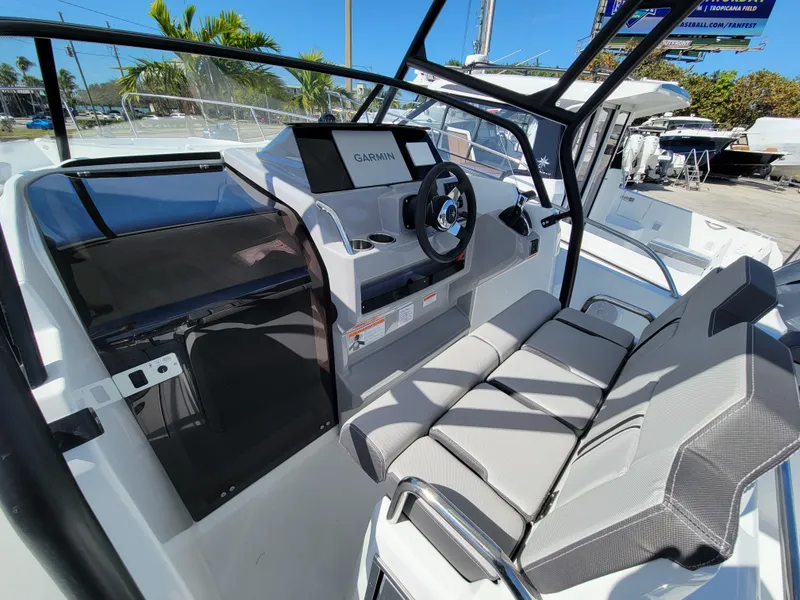 Slide: The Image of 2024 Jeanneau Leader WA 7.5 boat cockpit with Garmin navigation system. - 10