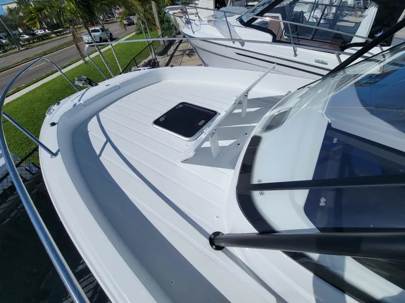 Slide: The Image of 2024 Jeanneau Leader WA 7.5 boat deck with hatch and railing. - 21