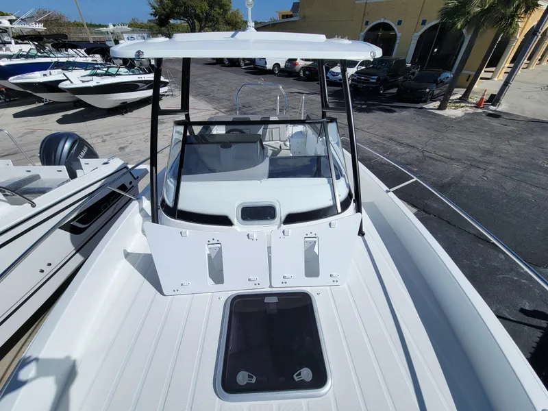 Slide: The Image of 2024 Jeanneau Leader WA 7.5 boat, front deck view at marina. - 24