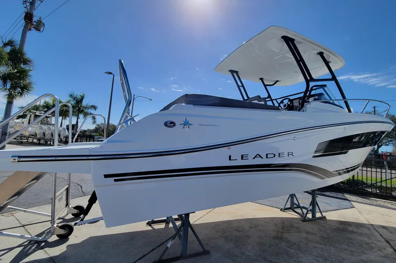 Slide: The Image of 2024 Jeanneau Leader WA 7.5 boat on display under clear blue sky. - 3