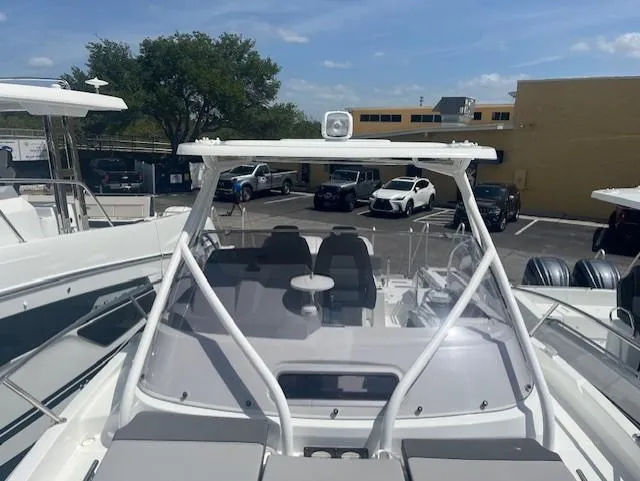 Slide: The Image of 2024 Jeanneau Leader 9.0 WA boat with spacious deck and seating area. - 12