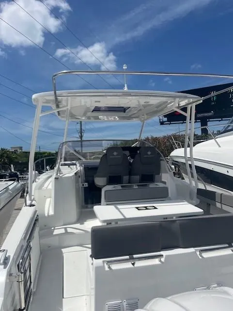 Slide: The Image of 2024 Jeanneau Leader 9.0 WA boat with spacious deck and seating. - 13