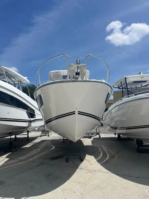 Slide: The Image of 2024 Jeanneau Leader 9.0 WA boat displayed outdoors under a clear blue sky. - 14